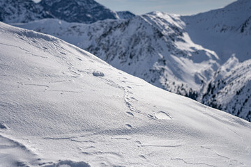 View of the Tatra Mountains in winter from the peak of Kasprowy Wierch. Sunny weather during a hike in the mountains.