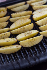 Electric grill with spicy potateos