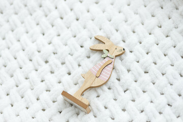 Easter bunny rabbit statuette. Easter toys. Close up, copy space.