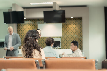 Passengers waiting to board the plane at the gate area