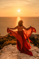 Woman in red dress, fashion model in evening dress, soaring in the street, sunset