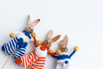 Easter toys. Easter rabbits on white background, copy space.