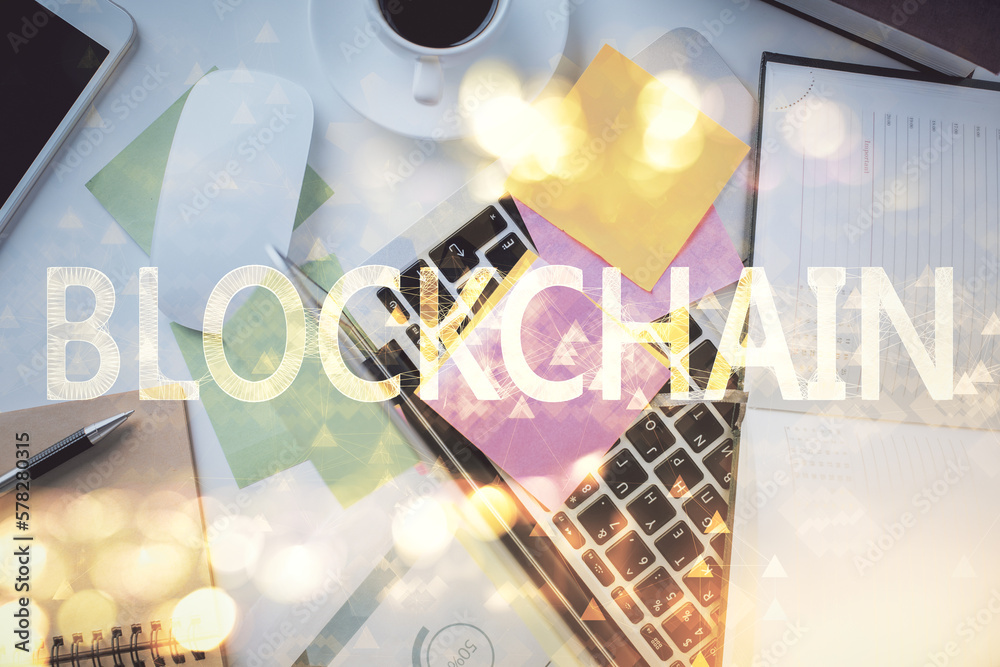 Poster Blockchain theme hologram drawings over computer on the desktop background. Top view. Multi exposure. Concept of cryptoeconomy.