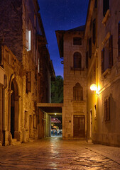Old street in Porec town illuminated by lamps at the evening, Croatia, Europe - 578282775