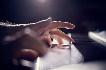 Pianist musician playing piano keyboard performing at live gig