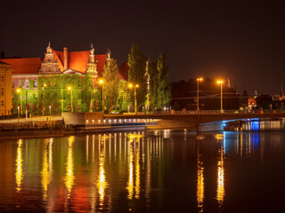 Fototapeta premium Wroclaw city night view on Oder river and National Museum
