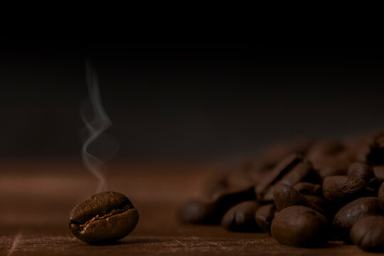 Coffee beans on a wooden background. Close up. Copy space. © Галя Дорожинська