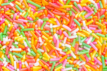 Fototapeta na wymiar Colorful rainbow sprinkles sugar texture pattern background. for cake , bakery and ice-cream or other