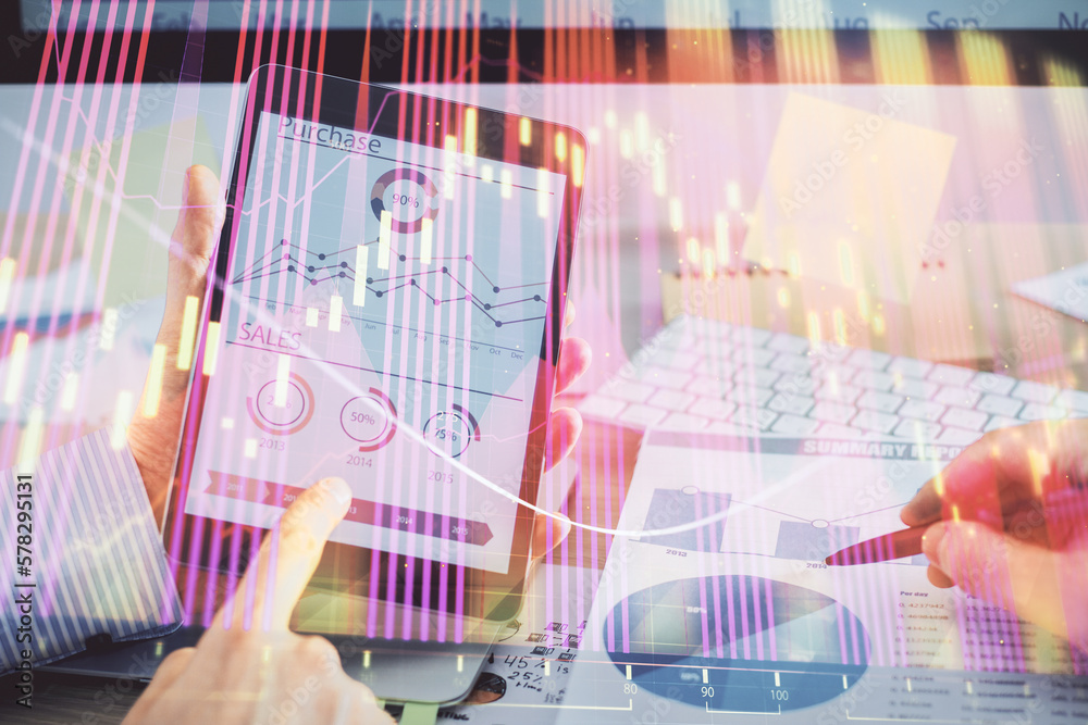 Poster multi exposure of man's hands holding and using a phone and financial chart drawing. market analysis