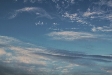 Obraz premium White light soft clouds floating in blue sky. Nature morning landscape background. Clear spring wind. Bright summer day. Winter calm air skyscape. Abstract panorama. Change climate. Low angle view