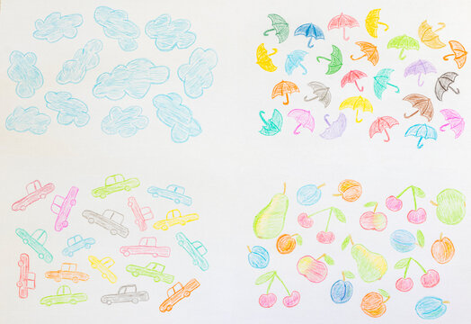 Drawing with colored pencils. Children drawing on a piece of paper.