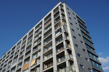 Fototapeta premium Modern residential building with balconies. Real estate and housing issues concept.
