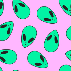 Seamless pattern in the fashionable style of the 90s, 2000s, Y2K. The heads of an alien on a pink background.