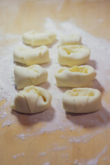 Sweet ravioli on a wooden board