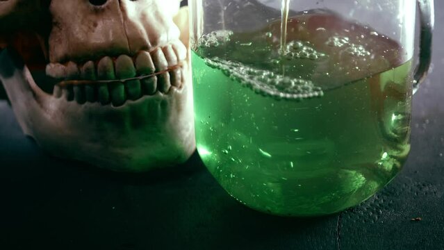 Halloween potion drink with skull