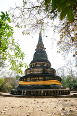 Large bell shaped chedi On top of old cave at Wat Umong Suan Puthatham, temple in Chiang Mai, Thailand. Temple of the tunnels and Buddha Dhamma garden.