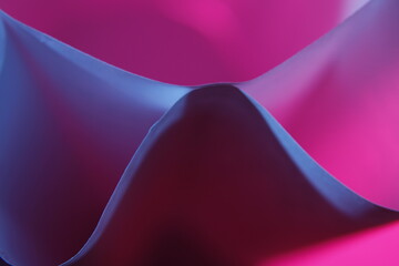 Papel para imporesiòn de  oficina con dobleces  formando triángulos y ondas en curvas con luz azul y rosa, forma un diseño abstracto muy original con fondo bokeh - obrazy, fototapety, plakaty