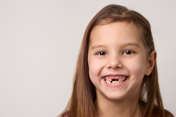 Happy smiling child girl on white background with copy space