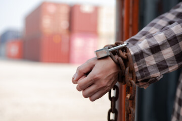  woman's hand trapped in an illegally smuggled container locked with chain and key. Efforts to...