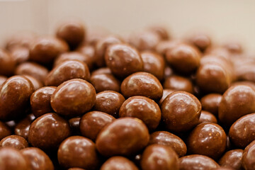 Close -up pounds in chocolate on a light background, horizontal