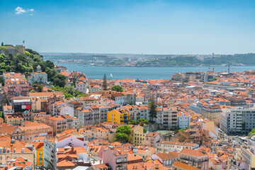 Fototapeta na wymiar Aerial view of Lisbon old town on Tagus river with medieval buildings and castle. Lisboa, Portugal skyline