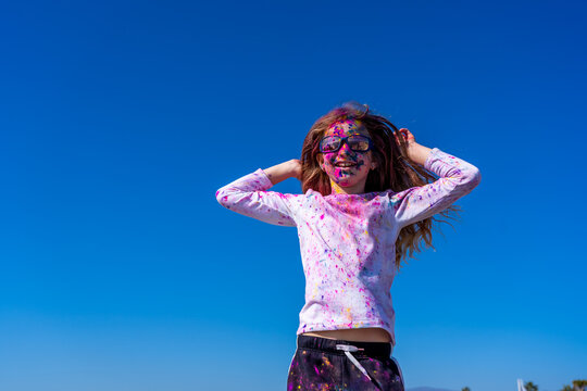 Young european girl celebrating holy festival on a blue sky background