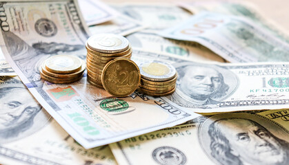 Fototapeta premium Dollar bills laid out on table. Three different columns of coins, 20 cents coin, financial crisis, money, finance, savings, salary, bank, euro cents. Photo, macro photography