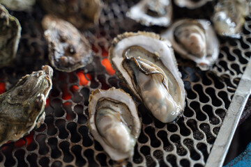 Grilled fresh oyster in Taiwan, famous street food.