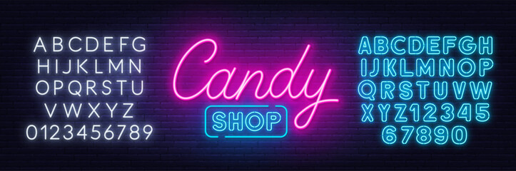Candy Shop neon sign on brick wall background.