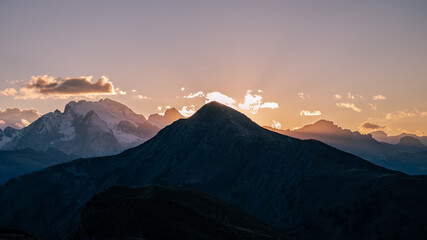 Sunset in the ranges and snow capped mountains of Dolomites, Italy