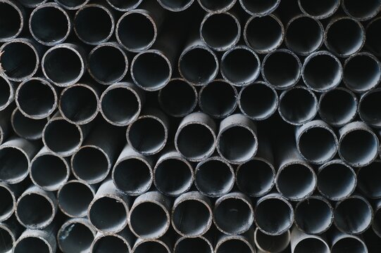 Stack of rolled metal products, perspective view of steel pipes of rectangular cross-section