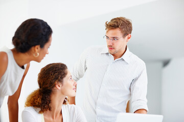 Fototapeta premium Business people in discussion. Business people using laptop and discussing.