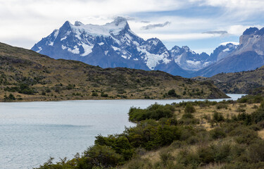 Fototapeta na wymiar Lake and snowy mountains of Torres del Paine National Park in Chile, Patagonia, South America