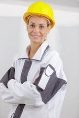 smiling house painting with arms crossed