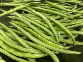 Washing fresh vegetables at the sink with water. Healthy Lifestyle, Green food. Organic Vegetables.