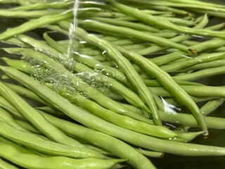 Washing fresh vegetables at the sink with water. Healthy Lifestyle, Green food. Organic Vegetables.