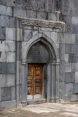 Fototapeta na wymiar Monastery courtyard. Entrance to the church. Beautiful temple architecture
