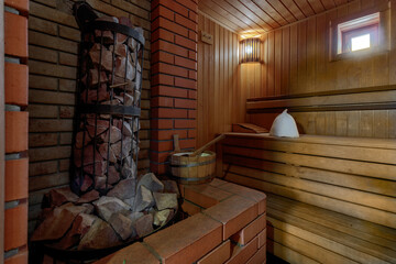 Sauna steam bath inside with stones and stove