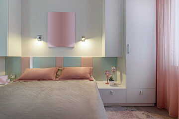 A modern bedroom in blue, pink and white colors with muffled lighting. Real photo