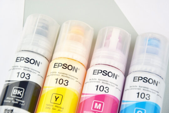 Four bottles of ink Epson, yellow, red, blue, black, built-in to the Epson L3150 series printer.