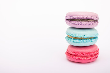 Macaroons, baked sweets from the pastry shop on white background, top view