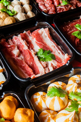 Selective focus on plenty choices of meat in pots for traditional charcoal grill BBQ style in all you can eat buffet.