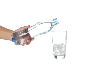 Female hand with bottle of water and glass, isolated on white background
