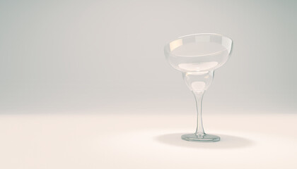 Margherita drinking glass. Empty glass on white studio backdrop.