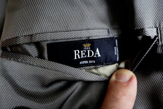 Italian Reda mill wool fabric label on a suit, Moscow, Russia - January 31, 2021