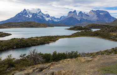 Fototapeta na wymiar Lake and snowy mountains of Torres del Paine National Park in Chile, Patagonia, South America