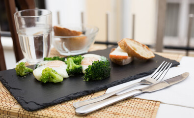 breakfast of crumpled eggs with broccoli