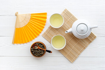 Asian tea ceremony with a fan. Chinese background