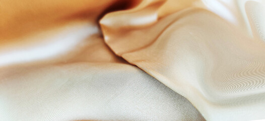 Luxurious smooth gold silk fabric design, silk fabric texture background element, luxurious shiny...