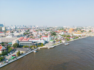 Aerial view city of Bangkok riverside with building and buddha temple